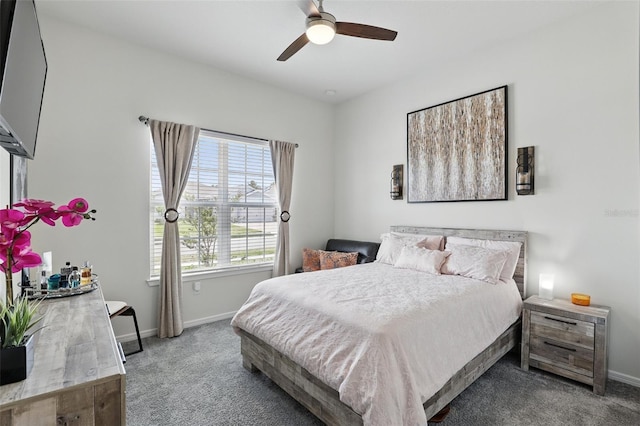 bedroom with baseboards, a ceiling fan, and carpet