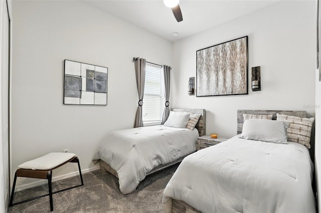 bedroom with baseboards, carpet flooring, and ceiling fan