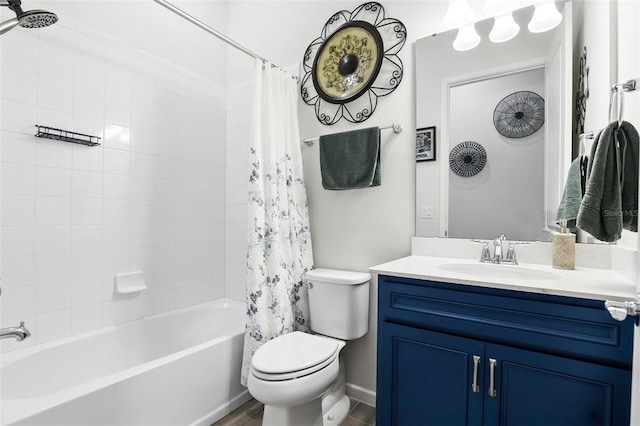 full bath with wood finished floors, shower / tub combo, toilet, and vanity
