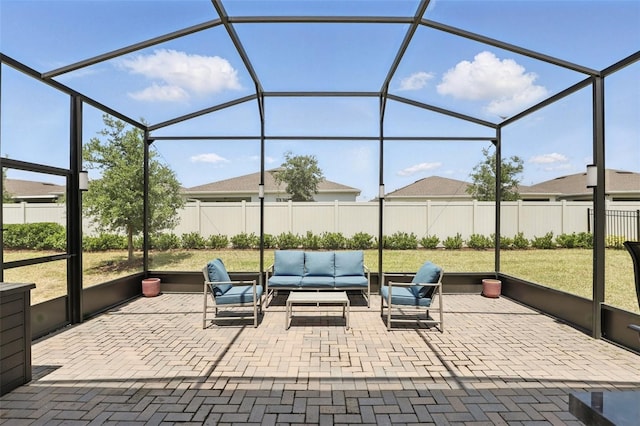 view of patio / terrace featuring a fenced backyard, outdoor lounge area, and glass enclosure