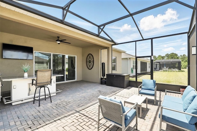 view of patio with an outdoor living space, ceiling fan, a lanai, and baseboard heating