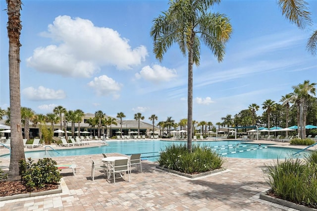 community pool featuring a patio area