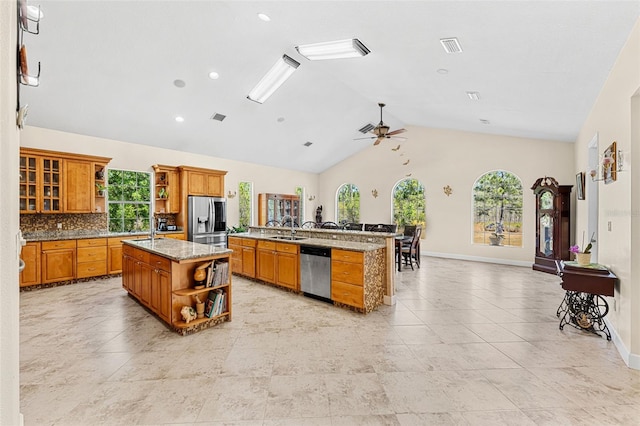 6005 Bancroft Blvd, Orlando, FL 32833 - kitchen with open shelves, stainless steel appliances, an island with sink, ceiling fan, and lofted ceiling