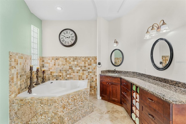 6005 Bancroft Blvd, Orlando, FL 32833 - full bath featuring vanity, a garden tub, and tile patterned floors