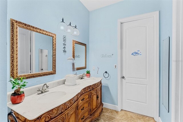 6005 Bancroft Blvd, Orlando, FL 32833 - bathroom with double vanity and tile patterned flooring