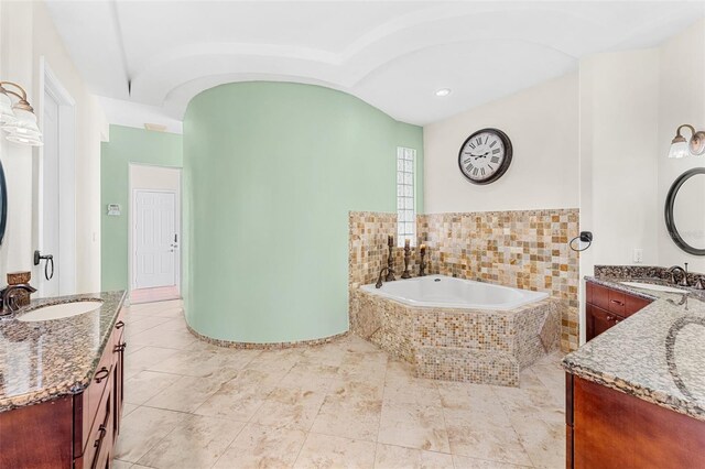 6005 Bancroft Blvd, Orlando, FL 32833 - bathroom featuring two vanities, a garden tub, tile patterned flooring, and recessed lighting