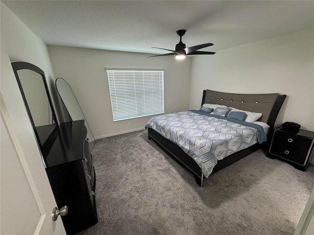 bedroom with carpet, baseboards, and a ceiling fan