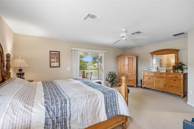 bedroom featuring visible vents, light colored carpet, ceiling fan, and access to outside