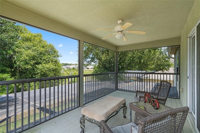 sunroom with a ceiling fan