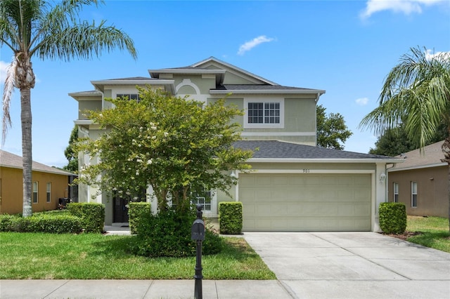 view of front of home featuring stucco siding, a garage, and concrete driveway