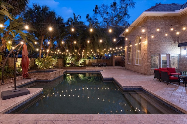 view of swimming pool with a patio area, a fenced in pool, and a fenced backyard