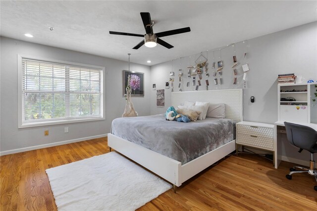 bedroom with recessed lighting, baseboards, wood finished floors, and ceiling fan