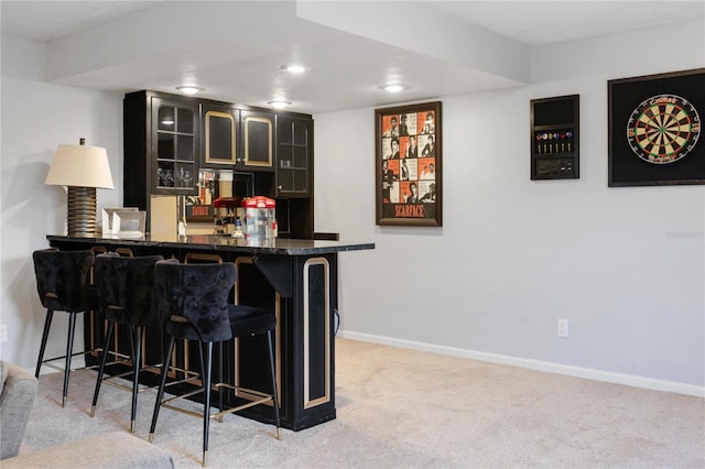 bar featuring recessed lighting, a dry bar, baseboards, and carpet