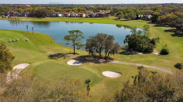 aerial view with view of golf course and a water view