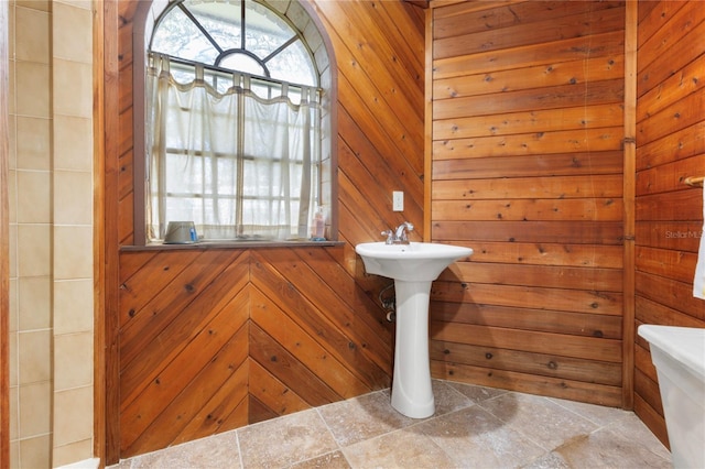 bathroom with wooden walls