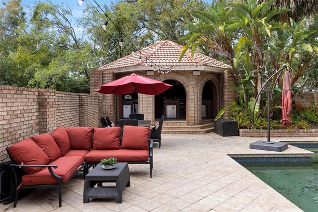 view of patio / terrace with a gazebo, fence, a fenced in pool, and an outdoor hangout area