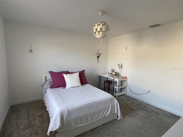 bedroom with visible vents, baseboards, and carpet