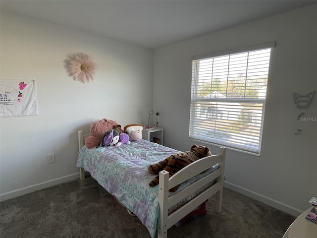 bedroom with carpet flooring and baseboards