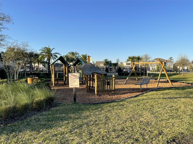 communal playground with a lawn