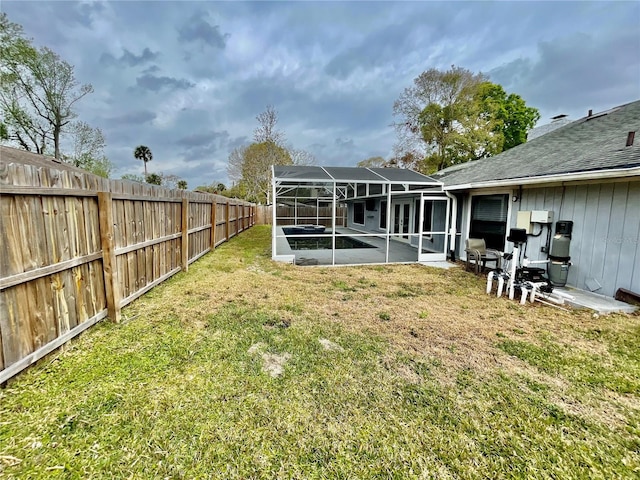 exterior space featuring glass enclosure, a patio area, a fenced backyard, and a pool