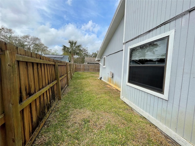 view of yard with a fenced backyard