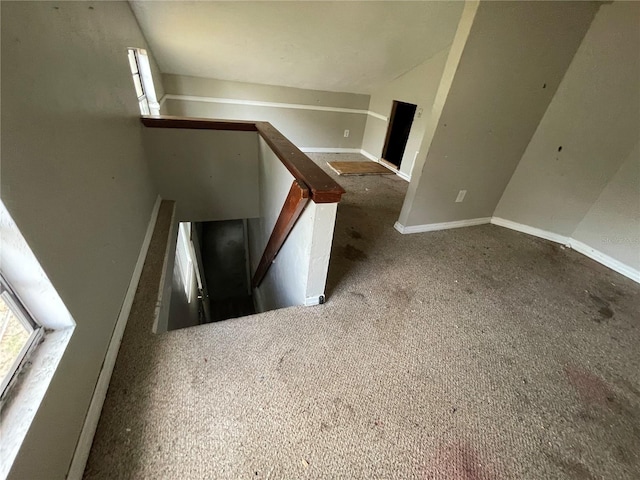 stairway with vaulted ceiling