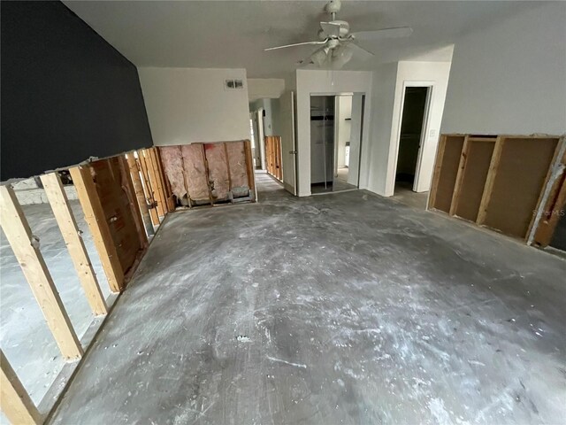 interior space featuring visible vents and a ceiling fan