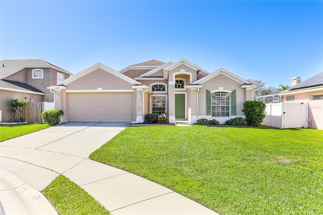 view of front of property featuring a garage, fence, driveway, stucco siding, and a front yard