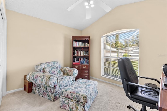 office featuring lofted ceiling, baseboards, a ceiling fan, and carpet flooring