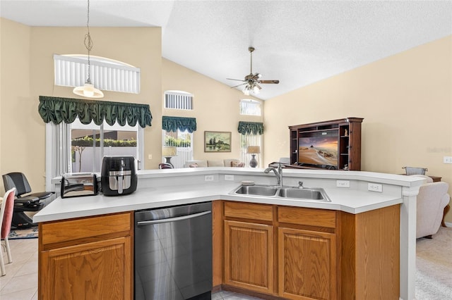 kitchen with open floor plan, light countertops, dishwasher, and a sink