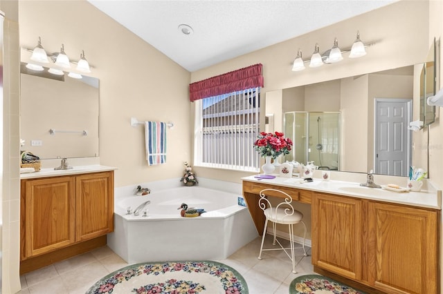 full bathroom with tile patterned flooring, a sink, two vanities, a shower stall, and a bath