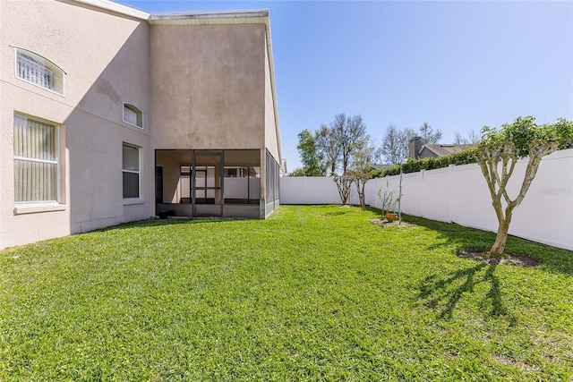 view of yard with a fenced backyard