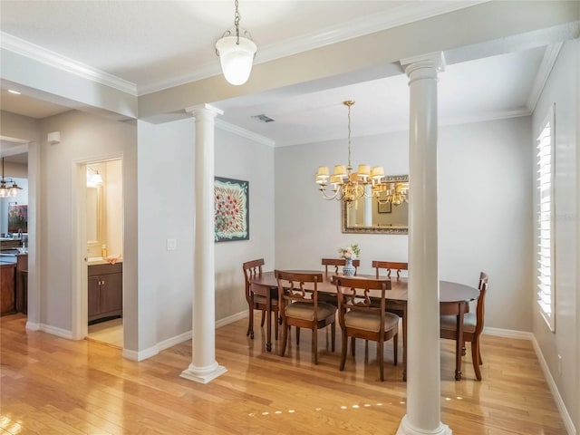 dining room with visible vents, light wood finished floors, decorative columns, and a healthy amount of sunlight