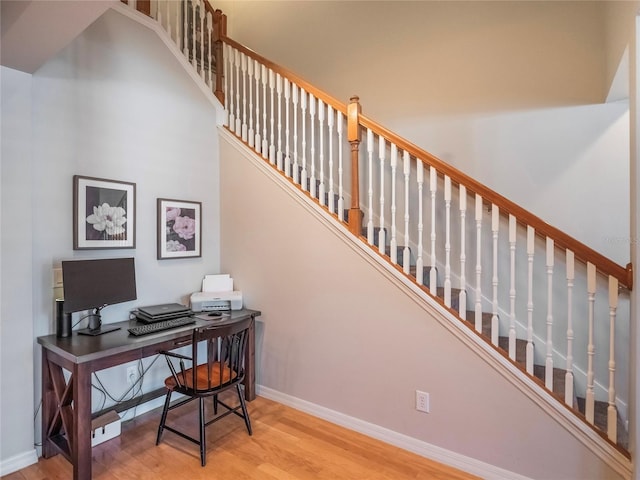 office featuring baseboards and wood finished floors