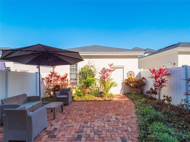 view of patio / terrace with a fenced backyard and an outdoor living space