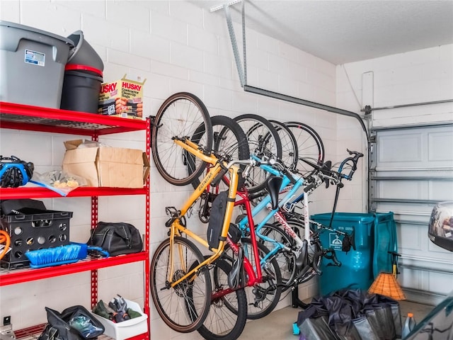 garage with concrete block wall and bike storage