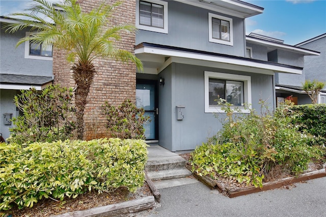 property entrance with brick siding