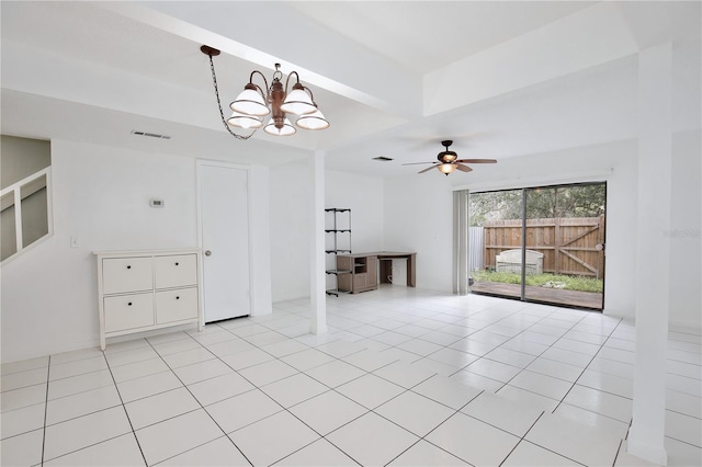 unfurnished room featuring ceiling fan with notable chandelier, visible vents, and light tile patterned floors