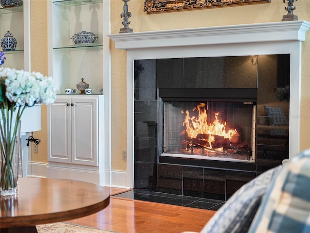 room details featuring a tile fireplace