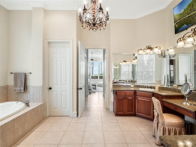 bathroom with a towering ceiling, ornamental molding, tile patterned floors, vanity, and a bath