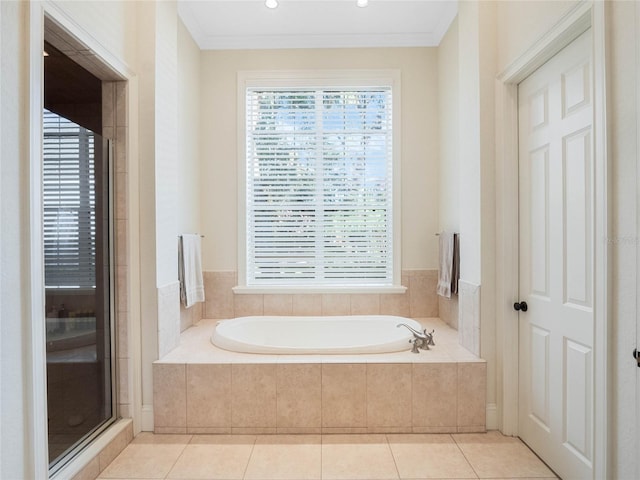 full bath with a garden tub, a shower stall, crown molding, and tile patterned floors