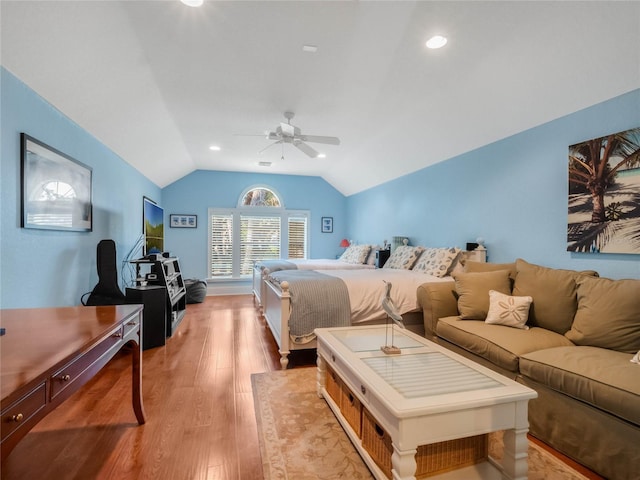 bedroom with a ceiling fan, vaulted ceiling, wood finished floors, and recessed lighting