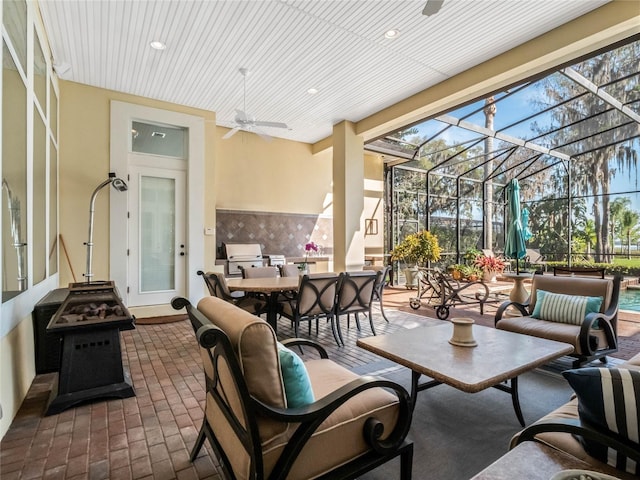 view of patio with an outdoor hangout area, outdoor dining area, a lanai, and a ceiling fan