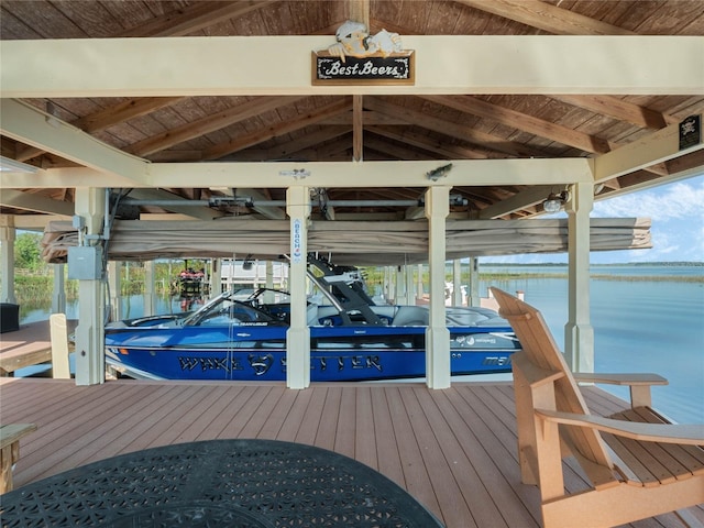 dock area featuring central AC unit, a water view, and boat lift