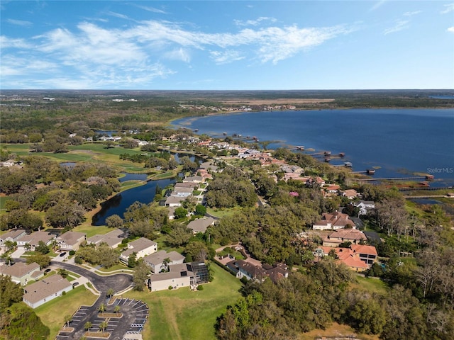 birds eye view of property featuring a water view and a residential view