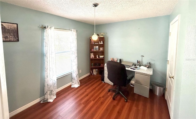 office with baseboards, dark wood finished floors, and a textured ceiling