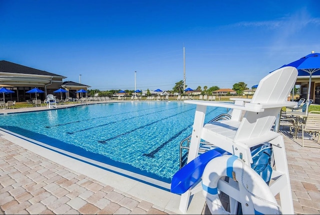 community pool featuring a patio area