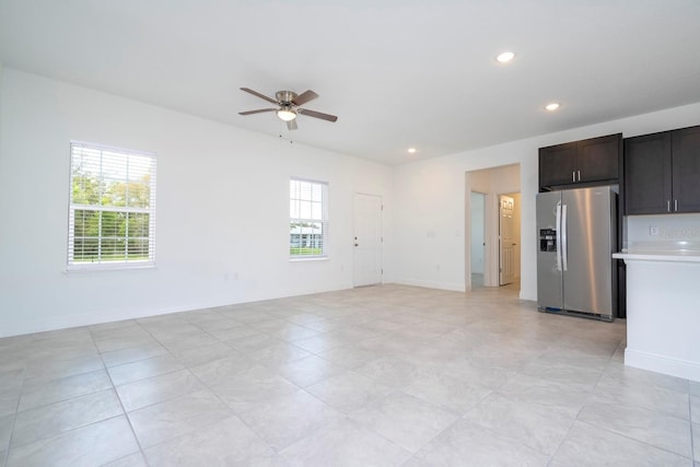 interior space with recessed lighting, ceiling fan, and baseboards