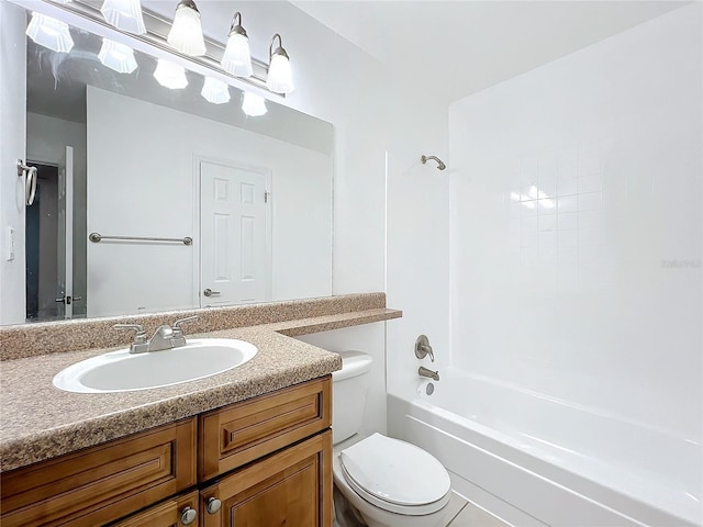 bathroom with toilet, washtub / shower combination, and vanity