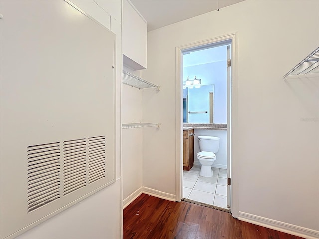 spacious closet with wood finished floors